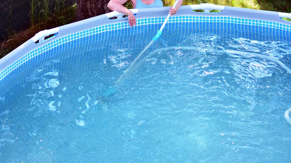 Cleaning bottom of swimming pool