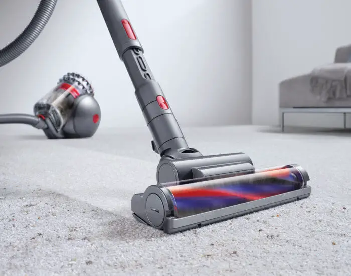 dyson vacuuming the carpet